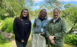 Alice Hope, Helen Roy, Sue Nelson standing on a wooded path by a river